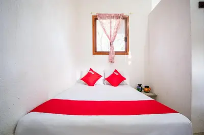 Cama o camas de una habitación en OYO Cabañas Abril, Mazunte