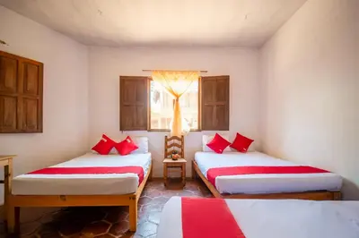 Cama o camas de una habitación en OYO Cabañas Abril, Mazunte