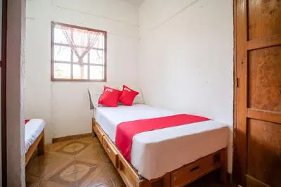Cama o camas de una habitación en OYO Cabañas Abril, Mazunte