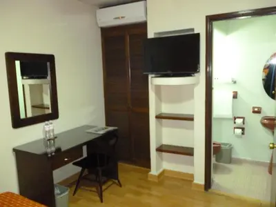 Una televisión o centro de entretenimiento en Hotel La Casona del Llano