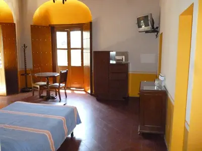 Cama o camas de una habitación en Hotel Monte Alban - Solo Adultos