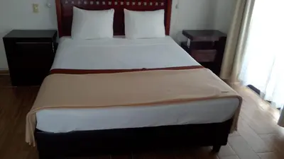 Cama o camas de una habitación en Hotel Real de San Diego