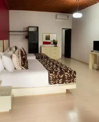 Cama o camas de una habitación en La Catrina de Alcala