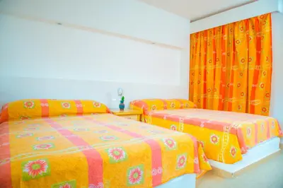 Cama o camas de una habitación en Hotel Acapulco