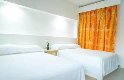 Cama o camas de una habitación en Hotel Acapulco