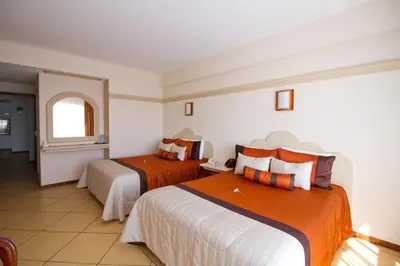 Cama o camas de una habitación en Hotel 9 Manantiales