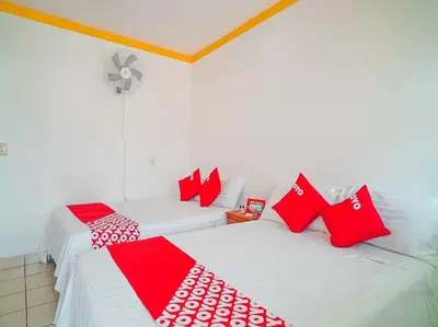 Cama o camas de una habitación en OYO Hospedaje Colibri
