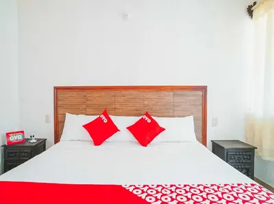 Cama o camas de una habitación en OYO Hospedaje Colibri