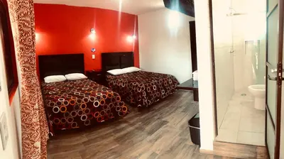 Cama o camas de una habitación en HOTEL LA GRAN MANZANA
