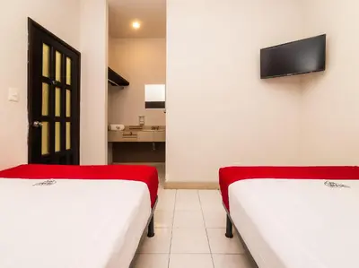 Cama o camas de una habitación en Hotel Río Puebla Centro