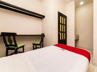 Cama o camas de una habitación en Hotel Río Puebla Centro