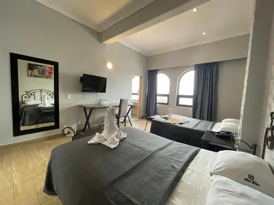 Cama o camas de una habitación en Hotel Palace Puebla