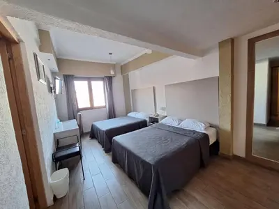 Cama o camas de una habitación en Hotel Palace Puebla