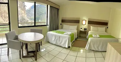 Cama o camas de una habitación en Hotel y Aguas Termales de Chignahuapan