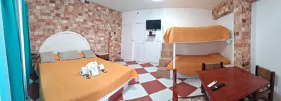 Cama o camas de una habitación en Hotel Villas del Rey