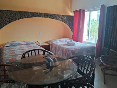 Cama o camas de una habitación en Hotel Villas del Rey