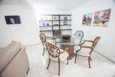 Una televisión o centro de entretenimiento en Suites Lafragua