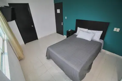 Cama o camas de una habitación en EMS Hoteles Boca del Río