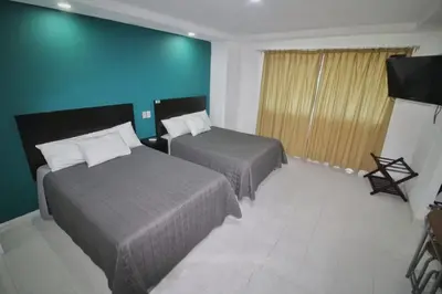 Cama o camas de una habitación en EMS Hoteles Boca del Río