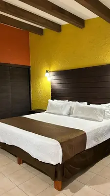 Cama o camas de una habitación en Hotel El Rancho