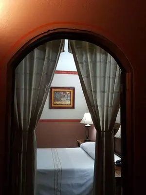 Cama o camas de una habitación en Hotel Posada San Jerónimo
