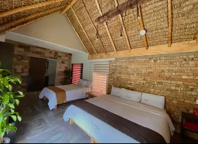 Cama o camas de una habitación en Hotel Villas Mariposas