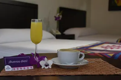 Cama o camas de una habitación en Hotel Mesón de la Chinantla
