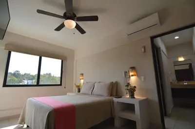 Cama o camas de una habitación en Hotel Coral Cuernavaca