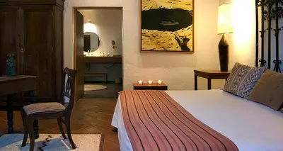 Cama o camas de una habitación en Hotel La Casona de Tita