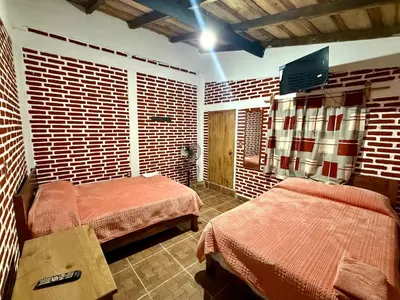 Cama o camas de una habitación en Hotel Cuaupatanini