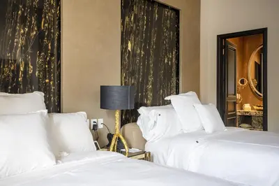Cama o camas de una habitación en L Hotel Perla Boutique