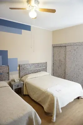 Cama o camas de una habitación en Hotel Palacio