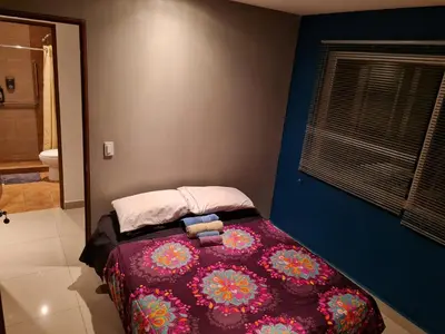 Cama o camas de una habitación en Division del Norte Rooms