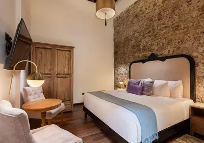 Cama o camas de una habitación en Hotel Casa Monarca