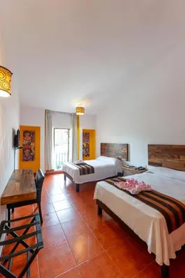 Cama o camas de una habitación en Hotel Santa Cruz Huatulco