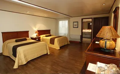 Cama o camas de una habitación en Suites Colibri