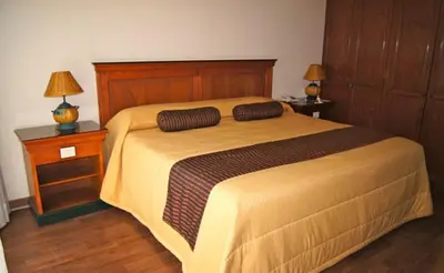 Cama o camas de una habitación en Suites Colibri