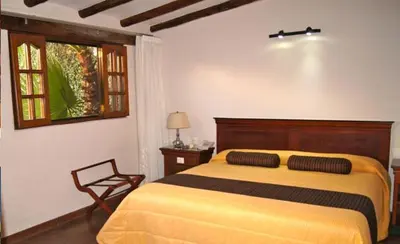 Cama o camas de una habitación en Suites Colibri