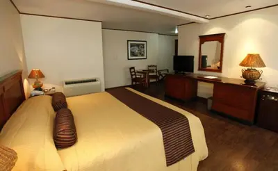 Cama o camas de una habitación en Suites Colibri