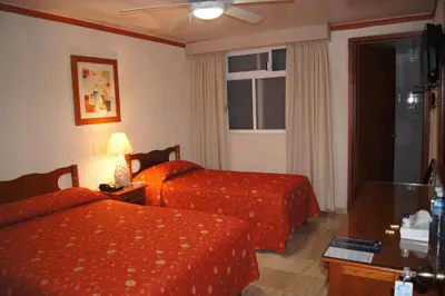 Cama o camas de una habitación en Hotel Veracruz