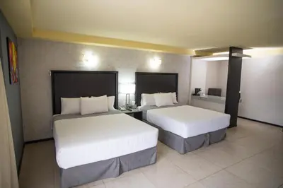 Cama o camas de una habitación en Hotel Ha
