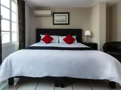 Cama o camas de una habitación en Boca Inn Hotel & Suites