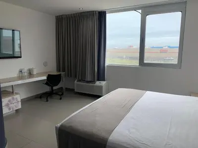 Cama o camas de una habitación en Hotel Punta Azul