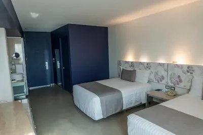 Cama o camas de una habitación en Hotel Punta Azul