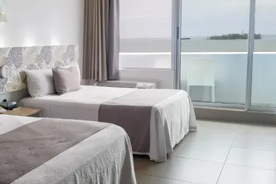 Cama o camas de una habitación en Hotel Punta Azul