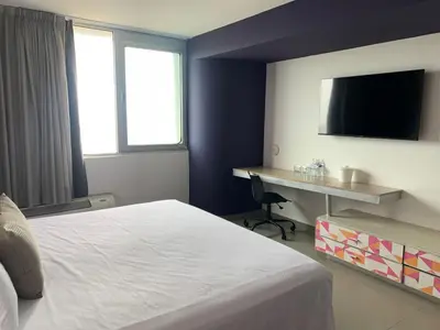 Cama o camas de una habitación en Hotel Punta Azul