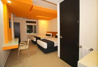 Cama o camas de una habitación en Nu Hotel