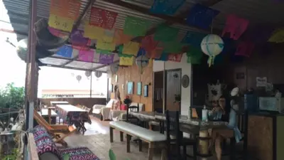 Un restaurante o sitio para comer en La casa del nenufar