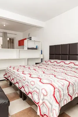 Cama o camas de una habitación en Hermoso departamento en Oaxaca con estacionamiento