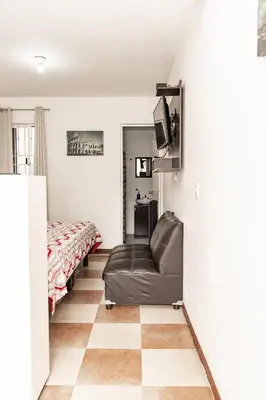 Una televisión o centro de entretenimiento en Hermoso departamento en Oaxaca con estacionamiento